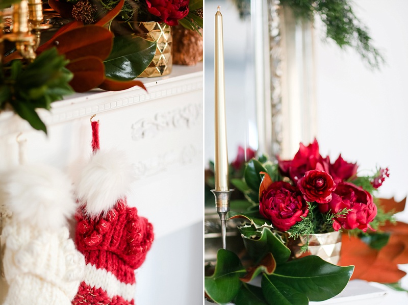 Christmas Flowers by E.H. Floral on a mantle with candles